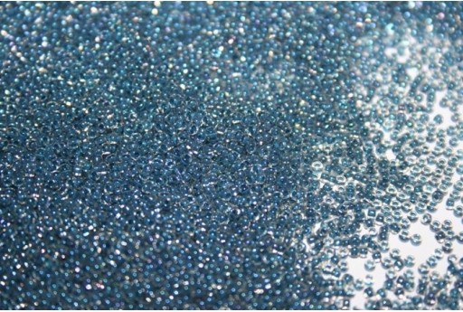 Perline Toho Round Rocailles 15/0, 10gr. Inside-Color Luster Crystal/Capri Blue Lined